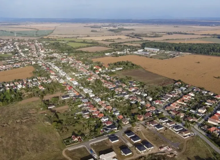 Aerial view of agricultural and forest land in Križovany nad Dudváhom with the village.
