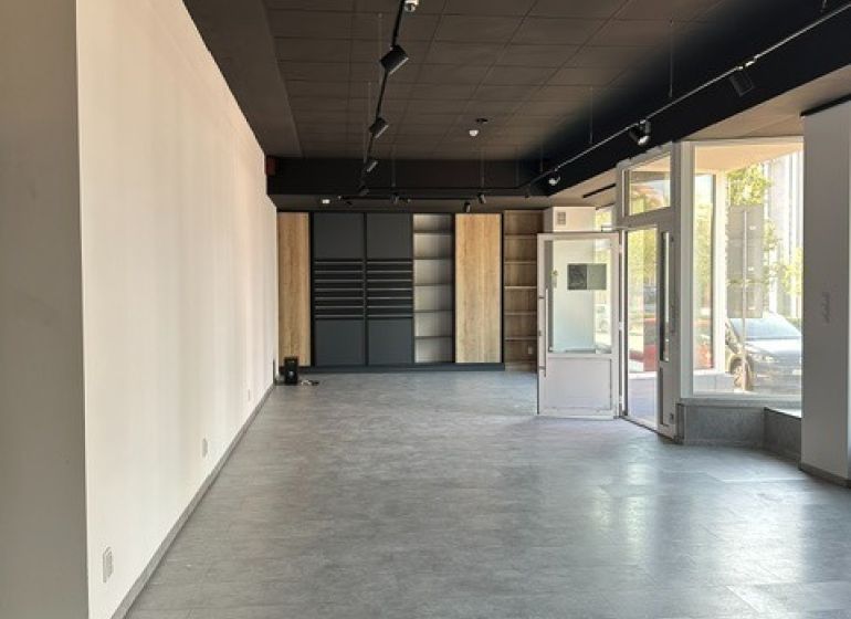 Spacious offices with large windows and decorative flooring.