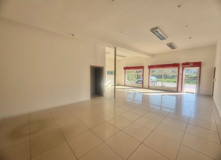Spacious commercial spaces with large windows and tiling, ideal for business.