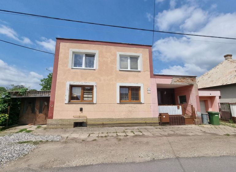 A family house on Šípošova Street in Šahy with a two-story facade and a garage.