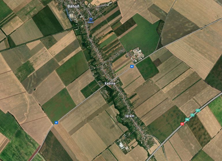 Aerial photograph of agricultural and forest lands near Kaplna, with road communications and surrounding settlements.