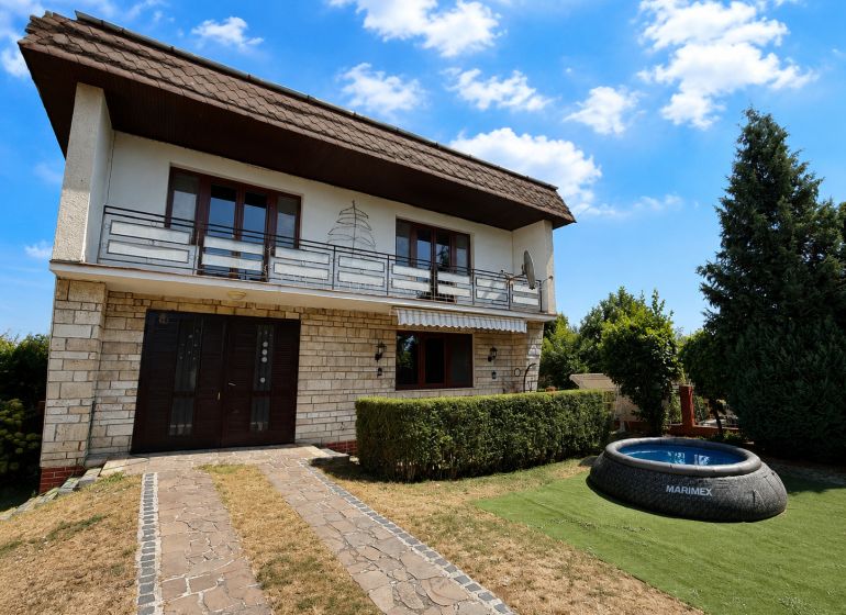 A family house in Topoľčany on Ľaliová Street with a swimming pool in the garden.