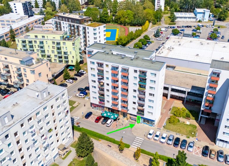 Aerial view of buildings and commercial spaces on Dvory Street in Púchov.