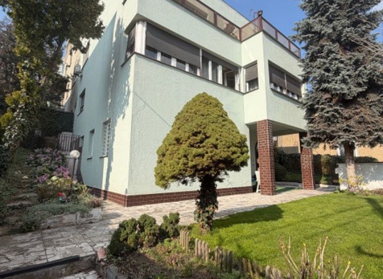 A villa on Bradlianska Street in Bratislava - Old Town with a garden and landscaped walkways.