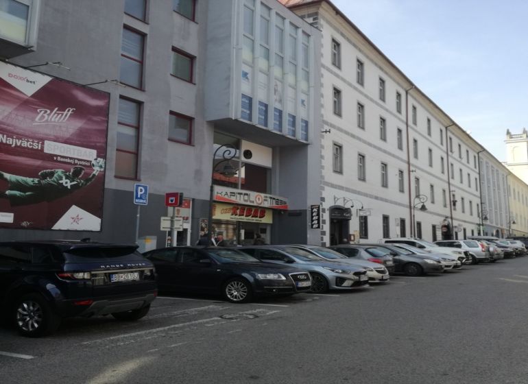 Commercial premises on Kapitulská Street in Banská Bystrica with parking and historic architecture.