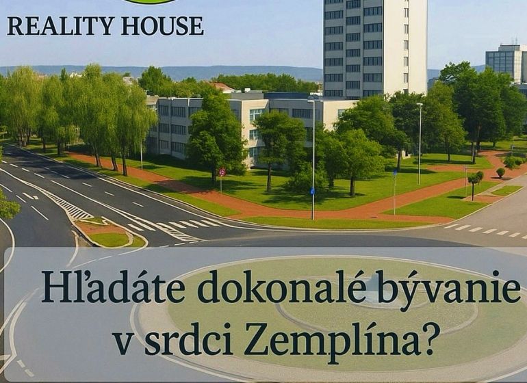 A building with a roundabout and greenery in the town of Michalovce.