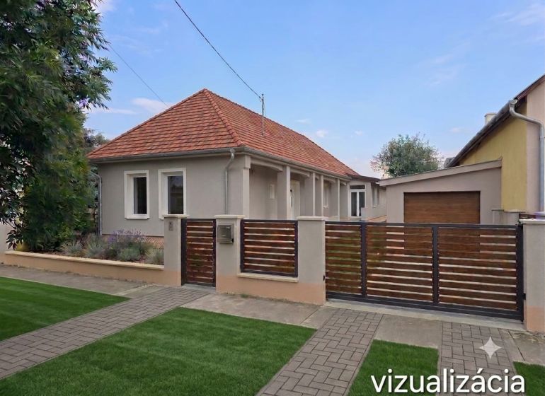 A family house in Kokšov-Bakša with a terracotta roof and a garden behind the gate.