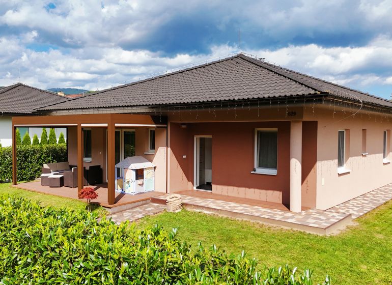 A family house in Bytča with a terrace, landscaped garden, and children's playground.