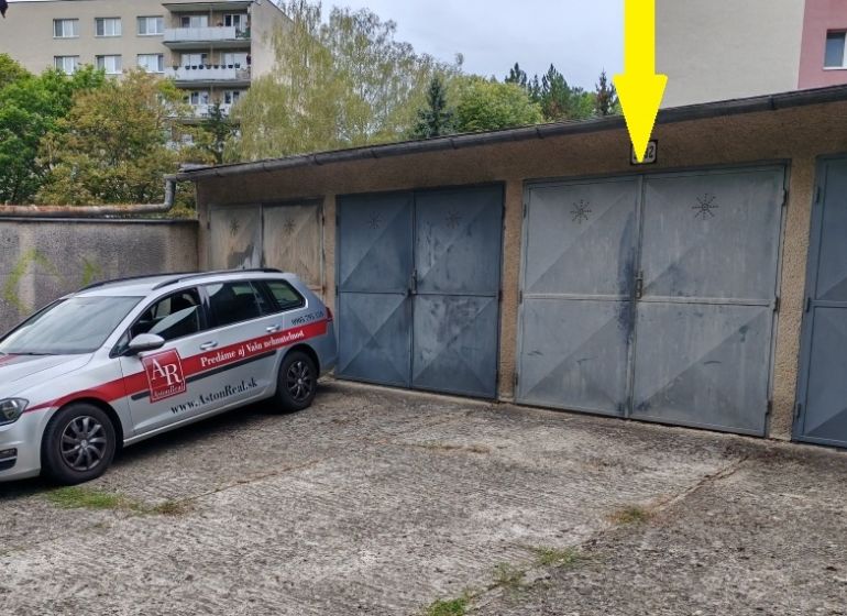 Garages on Partizánska Street in Trenčín, car for real estate services, woman with a cap.