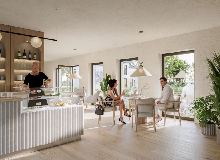 A café in offices with wood-decor flooring, two people, and a bar counter.