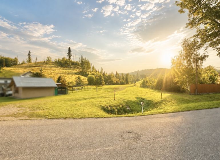 Sunny view of a meadow in Raková on Raková Street, ideal for residential plots.