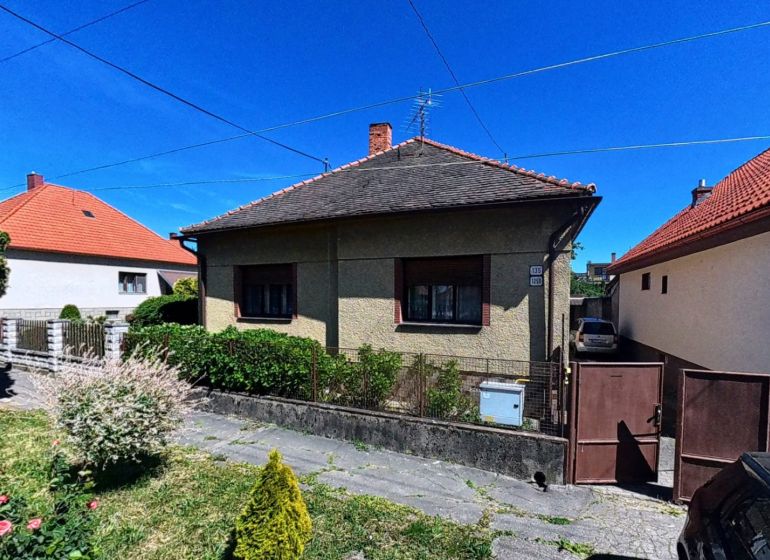 A family house on Sládkovičova 135 in Zlaté Moravce, with a garden and a car.