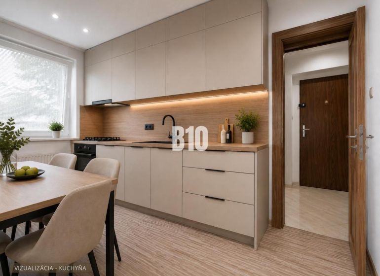 A bright kitchen with wood-patterned flooring and a simple table in a three-room apartment.