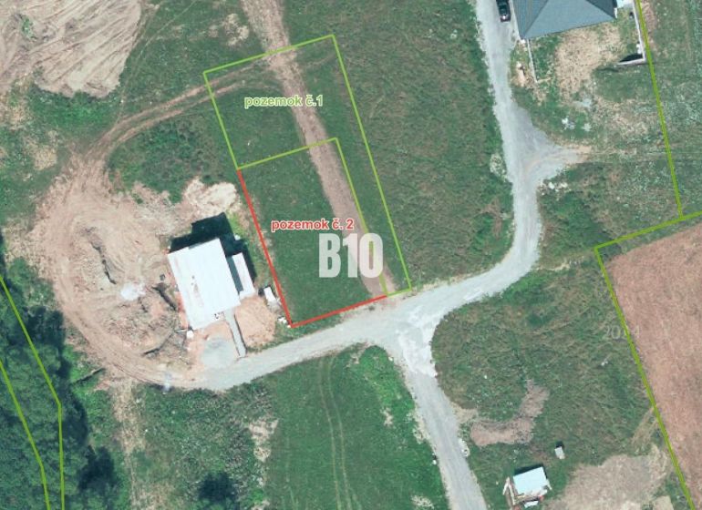 Aerial view of residential plots in the village of Bitarová, showing the surrounding area.