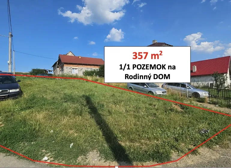 A grassy plot in Raslavice marked for construction purposes - residential.