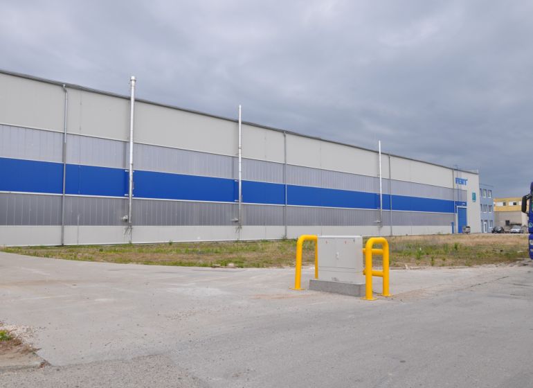 Production premises on Priemyselná Street in Galanta with a blue-gray design and a truck.