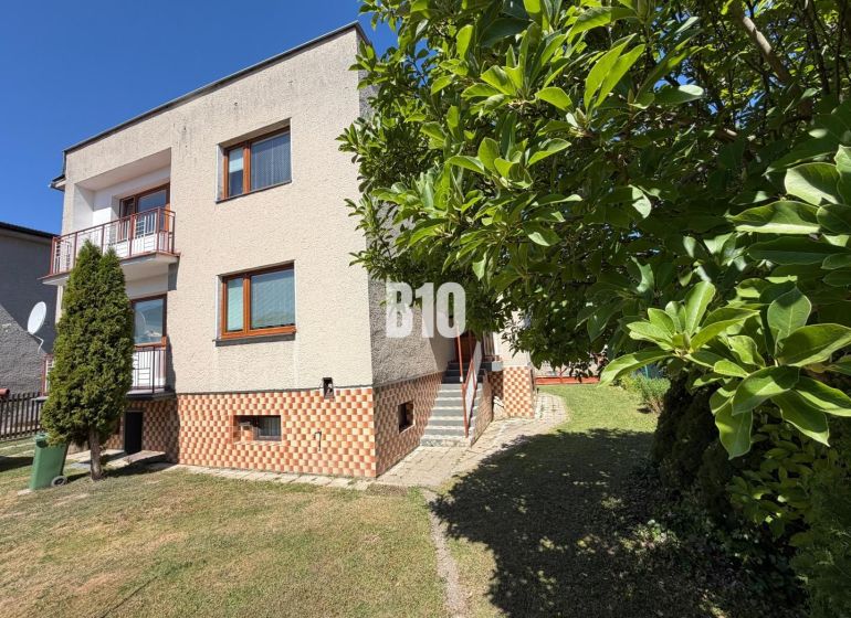 A family house in Kláštor pod Znievom with greenery and a balcony, set in a spacious garden.