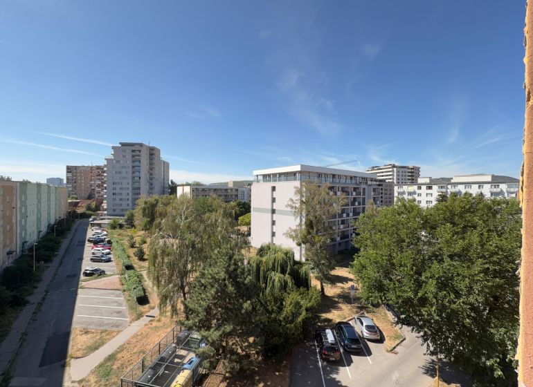 View of apartment buildings and trees on Stromová Street in Košice, Old Town.