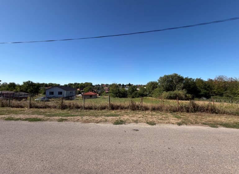 A plot for construction in Lukáčovce on Tichá Street, surrounded by nature and houses.