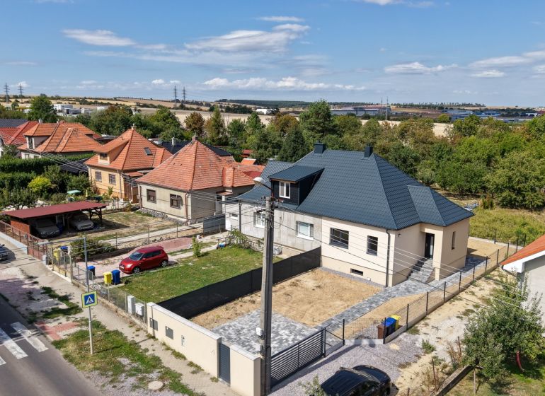 A family house on Trnavská Street in Nitra surrounded by gardens and neighboring houses.