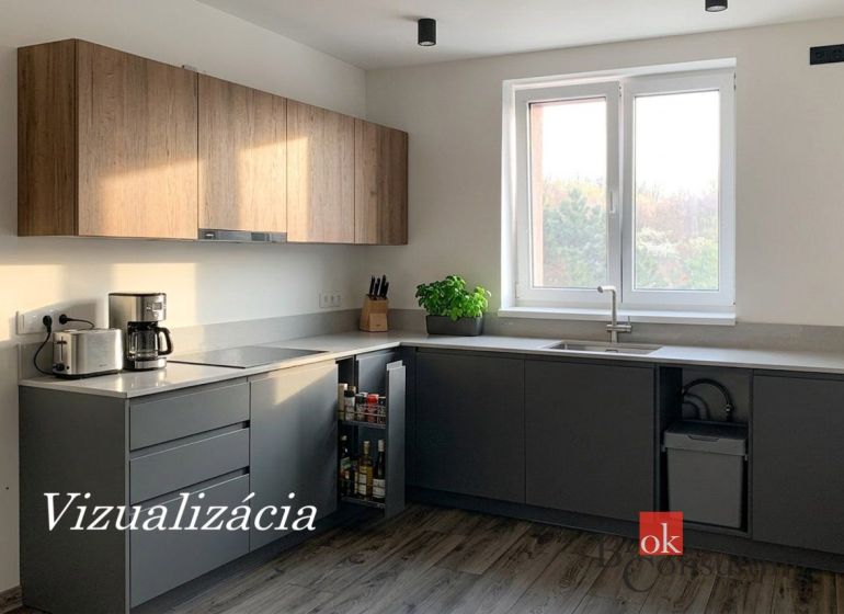 A kitchen in a one-room apartment with a wooden decor floor and a kitchen unit.