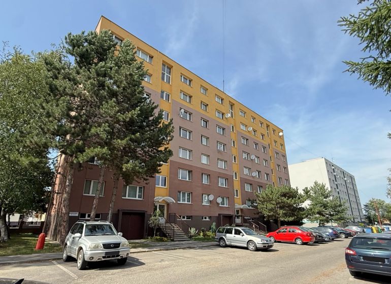 Mudrochova Street in Rajec shows an apartment building and a parking lot for 2-bedroom apartments.
