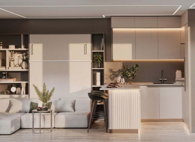 Interior of a family house with a kitchen, living area, and wooden decor flooring.