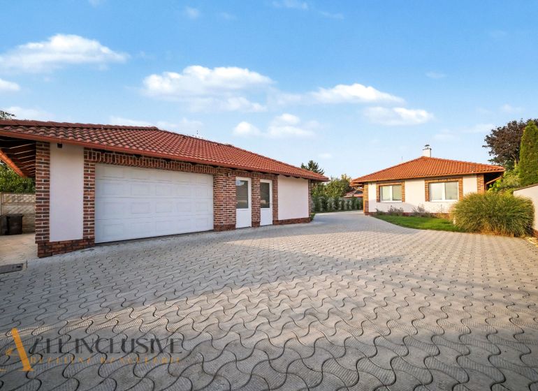 A family house in Kostolné Kračany near Dunajská Streda with a garage and a paved driveway.