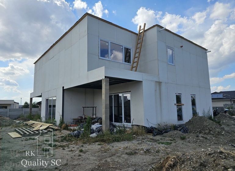 Unfinished family house on Lichnerova Street in Senec, with a white facade and a ladder.