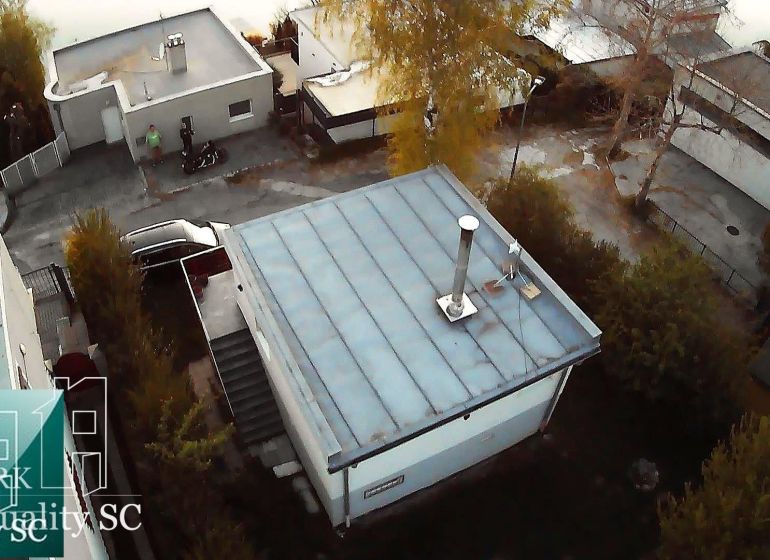 Drone view of a cottage in Senec on SLNEČNÉ JAZERÁ JUH street, surrounded by greenery.