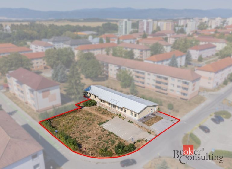 Commercial premises in Žiar nad Hronom on Š. Moysesa Street, surrounded by residential buildings.