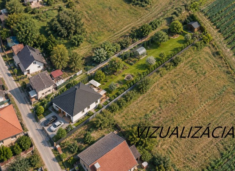 Aerial view of family houses in Mikušovce surrounded by greenery and gardens.