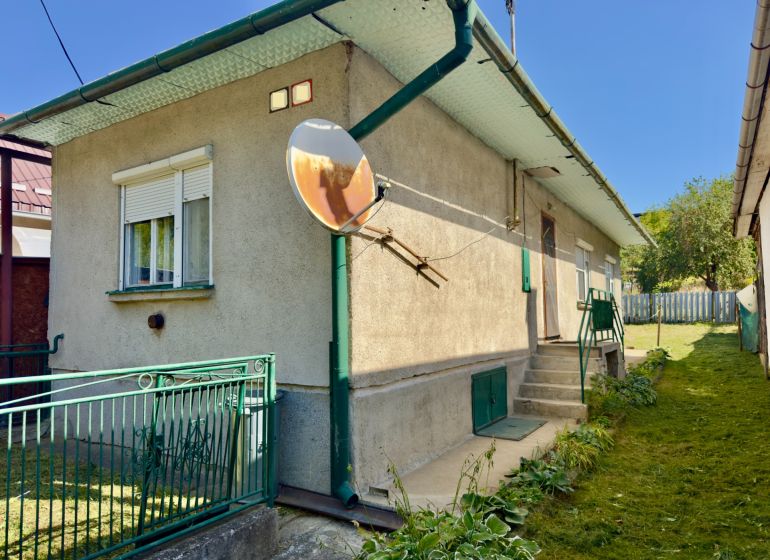 A family house in Lipany with a landscaped garden and a satellite on the facade.