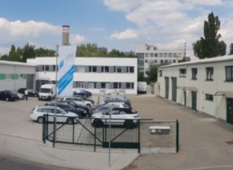 Unusual properties on Za stanicou street in Bratislava - Nové Mesto, parking lot and buildings.