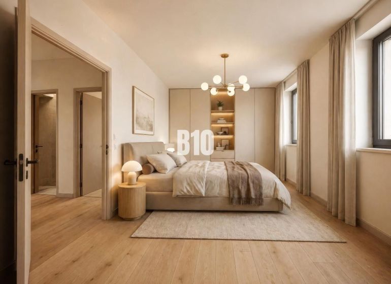 A bedroom in a family house with a wood-patterned floor, a soft carpet, and natural color scheme.