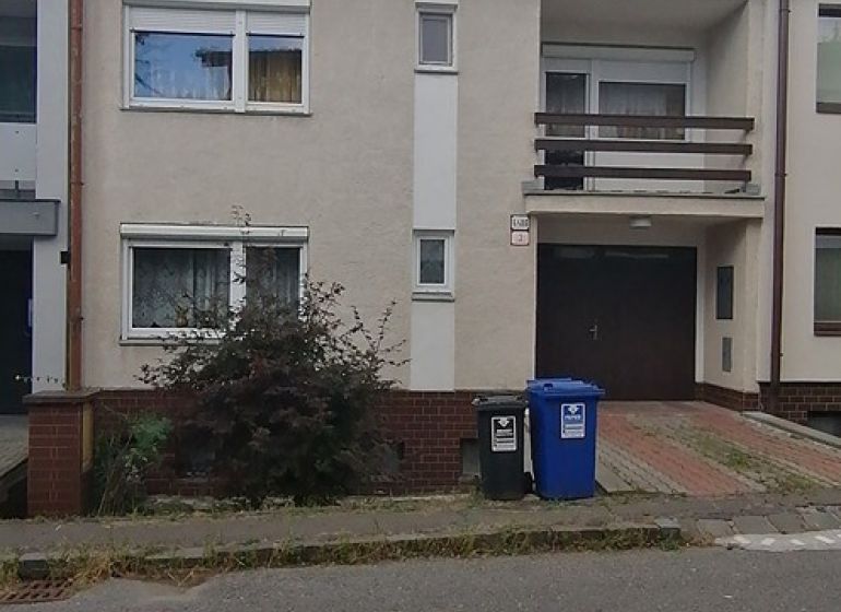 Family house on Astrova Street in Banská Bystrica with a balcony and driveway.