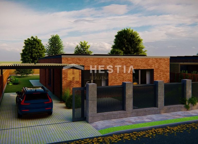 A family house in Hlboké, brick facade, car parked under a pergola, green trees.