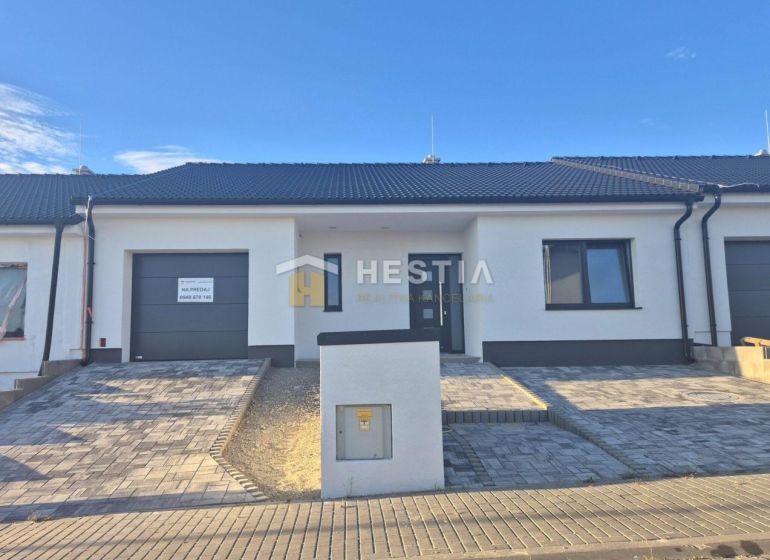 A family house in Hlboké, a single-story building with a garage and a paved driveway.