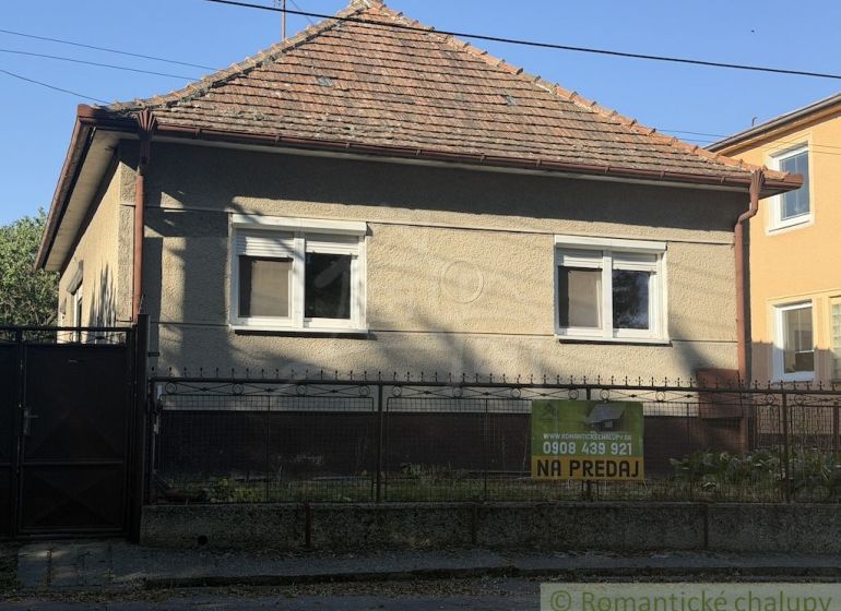 Family house for sale in Tvrdošovce, with a classic roof and a small front garden.