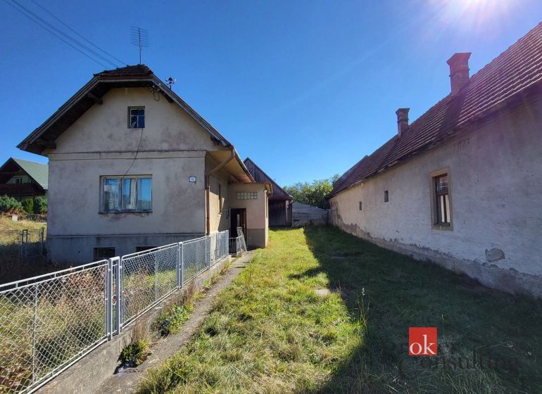 A family house in Žiar with a garden and two buildings, on the sunny side.