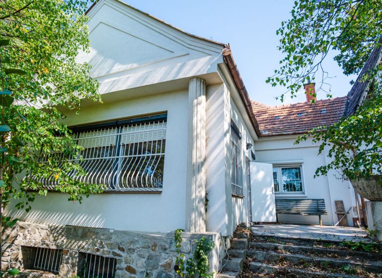 A family house on Chmeľová dolina in Nitra with a stone plinth and a terrace.