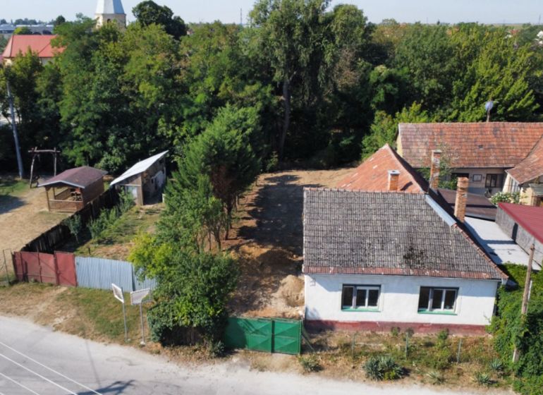 A family house on St. Florian Square, Krakovany, surrounded by greenery and a children's playground.