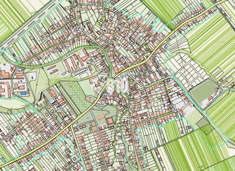 The map of the village Košeca shows the layout of streets, buildings, and adjacent fields.