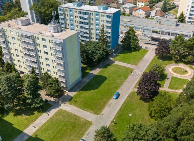 Apartment blocks and greenery on 8th May Street in Piešťany.
