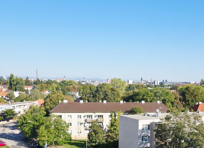 View of a residential area and greenery, Trnava, from a height, suitable for a 3-room apartment.