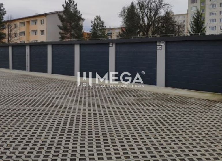 Garages on Laborecká Street in Humenné with a reinforced parking area and surrounding vegetation.