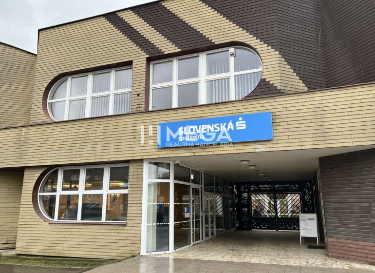 The exterior of the offices on Main Street in Stropkov with dominant rounded windows.