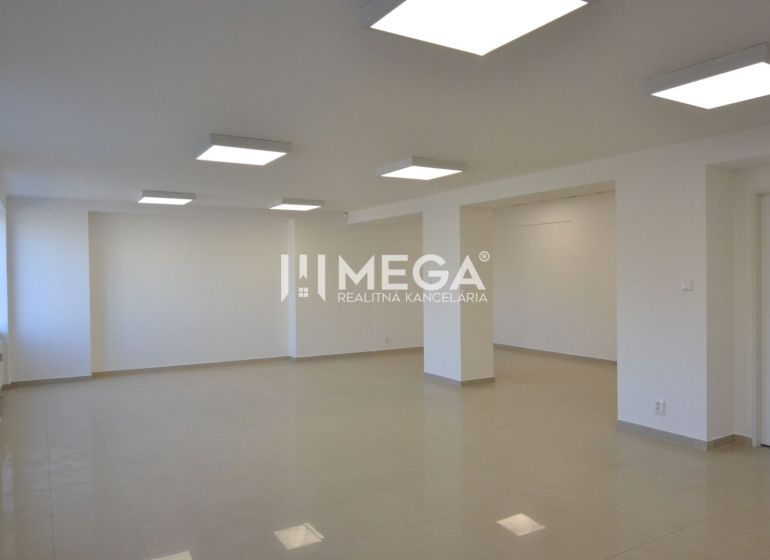 Bright commercial spaces with ceramic flooring and ceiling lighting in Humenné.