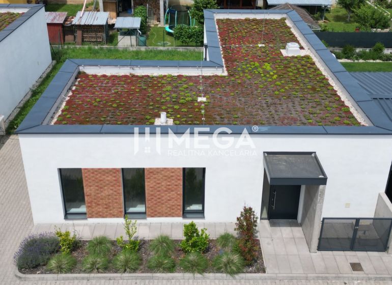 A family house on Gaštanová Street in Humenné with an extensive green roof and a parking space.