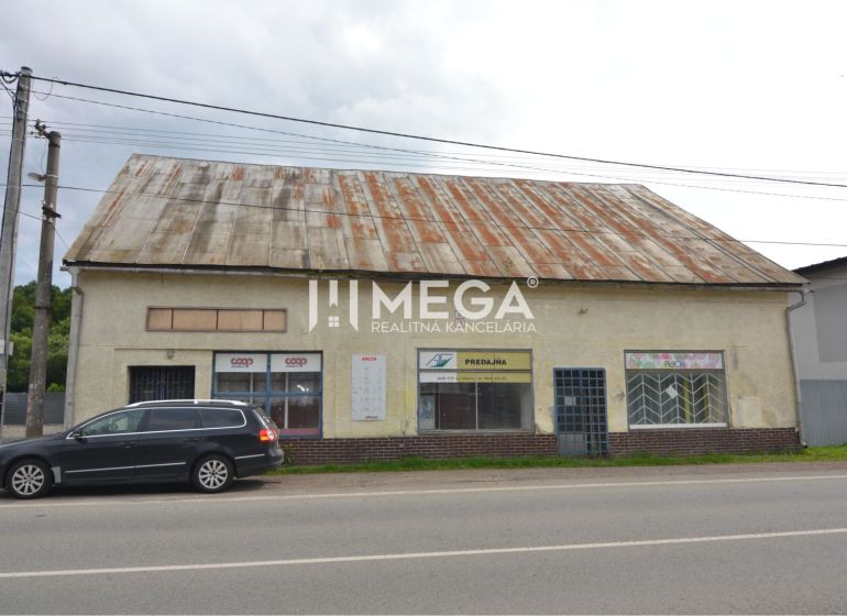 Commercial premises in Stakčín on Mieru Street with a damaged roof and a parked car.